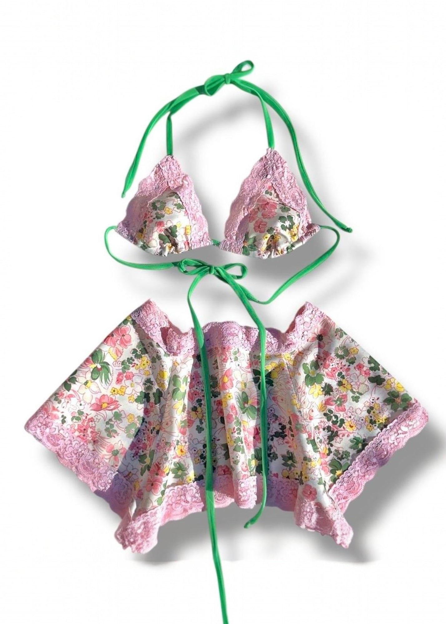 Floral bikini set with green straps on a white background