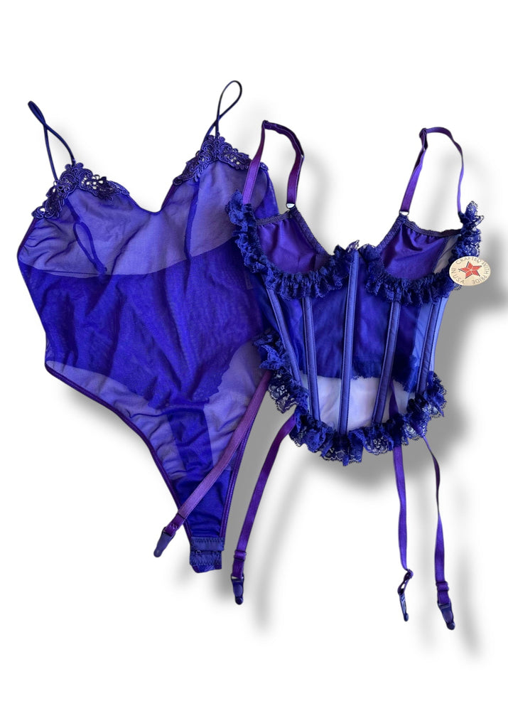 Purple lingerie set with ruffled details on a white background