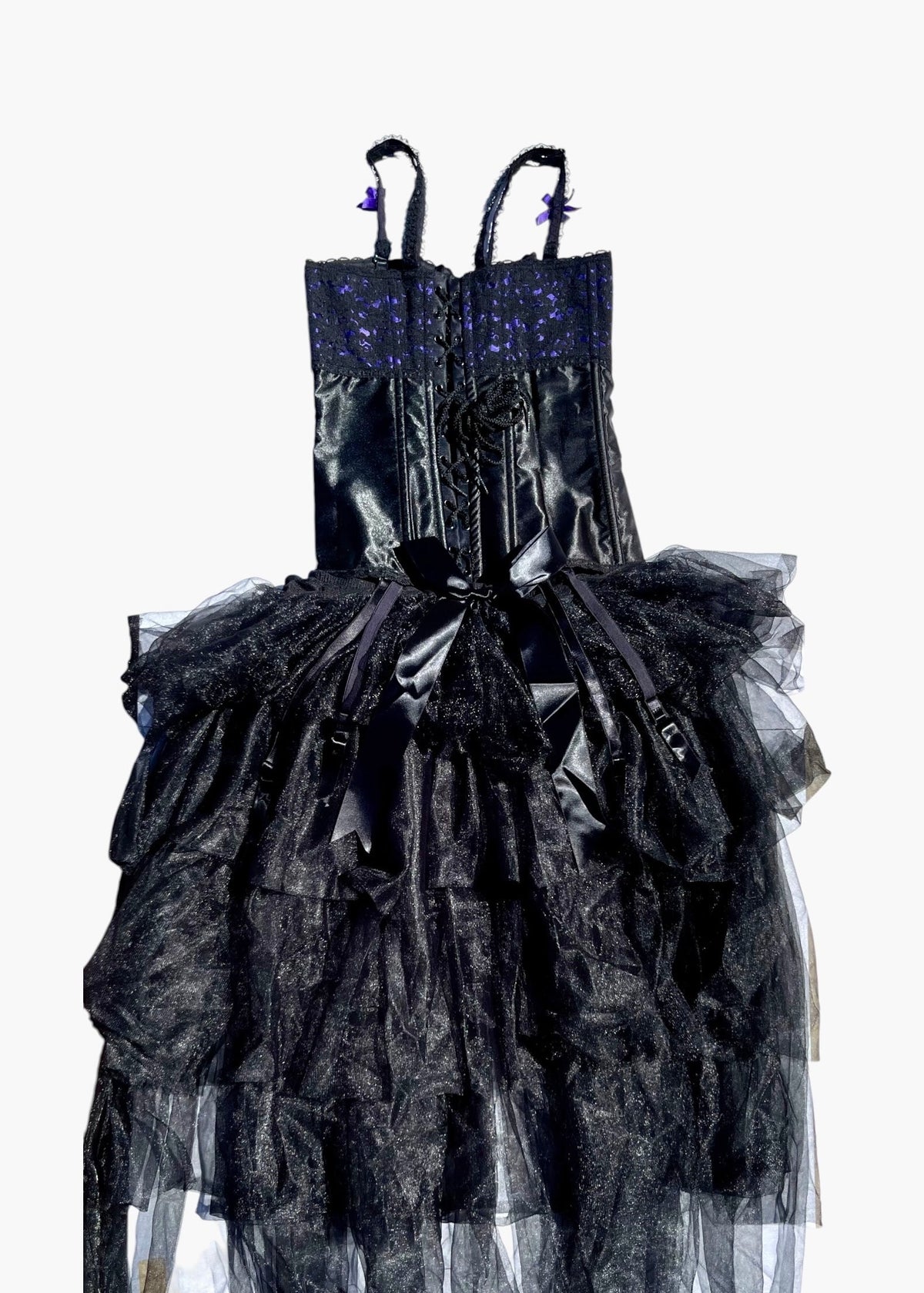A black gothic-style dress with a sheer, layered tulle skirt, a corseted waist, and a sparkling dark blue beaded bodice, shown against a plain white background.