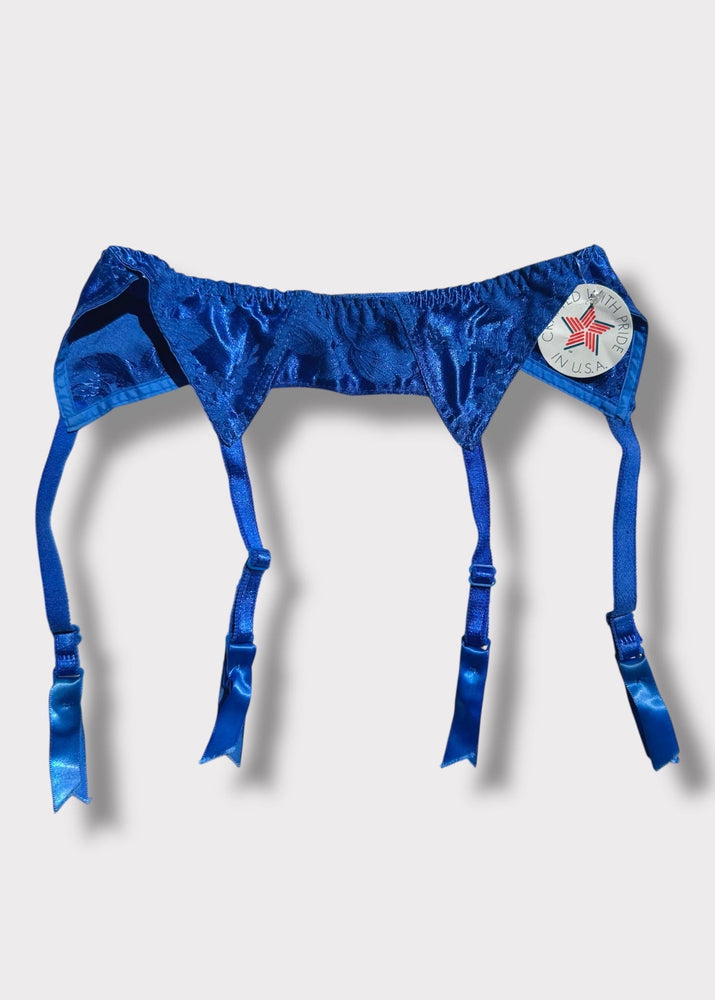 Blue satin garter belt with a star detail on a light gray background