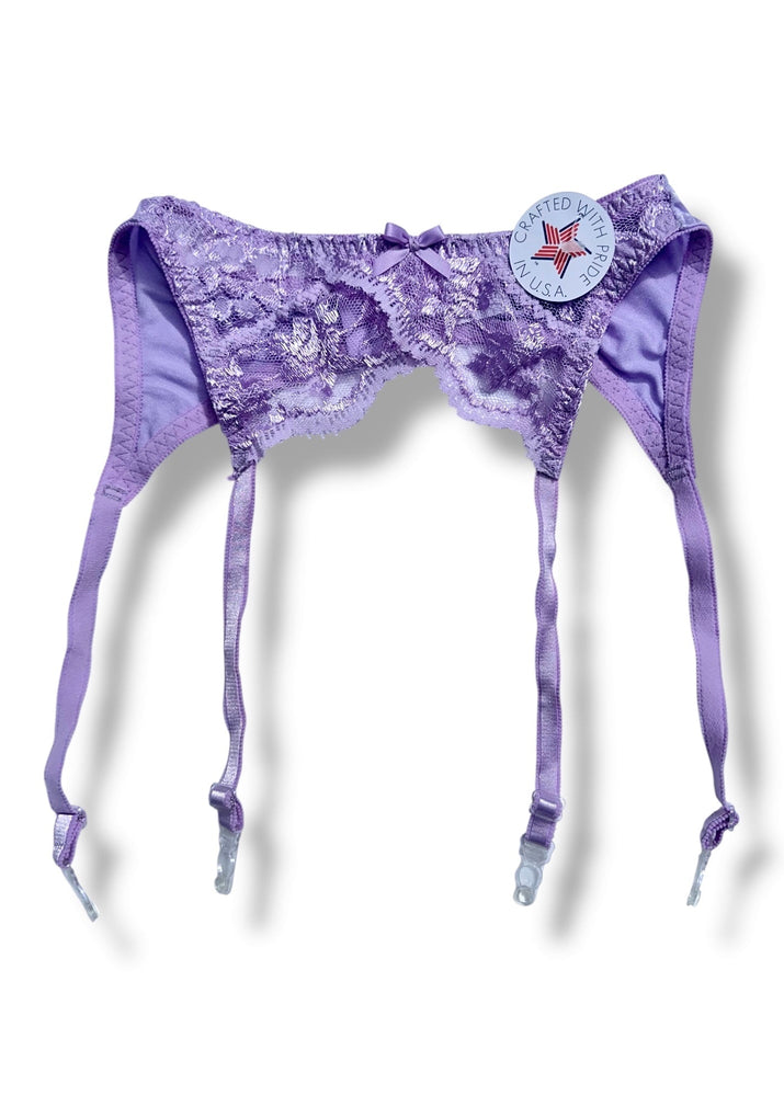 Purple lingerie set with matching stockings on a plain background