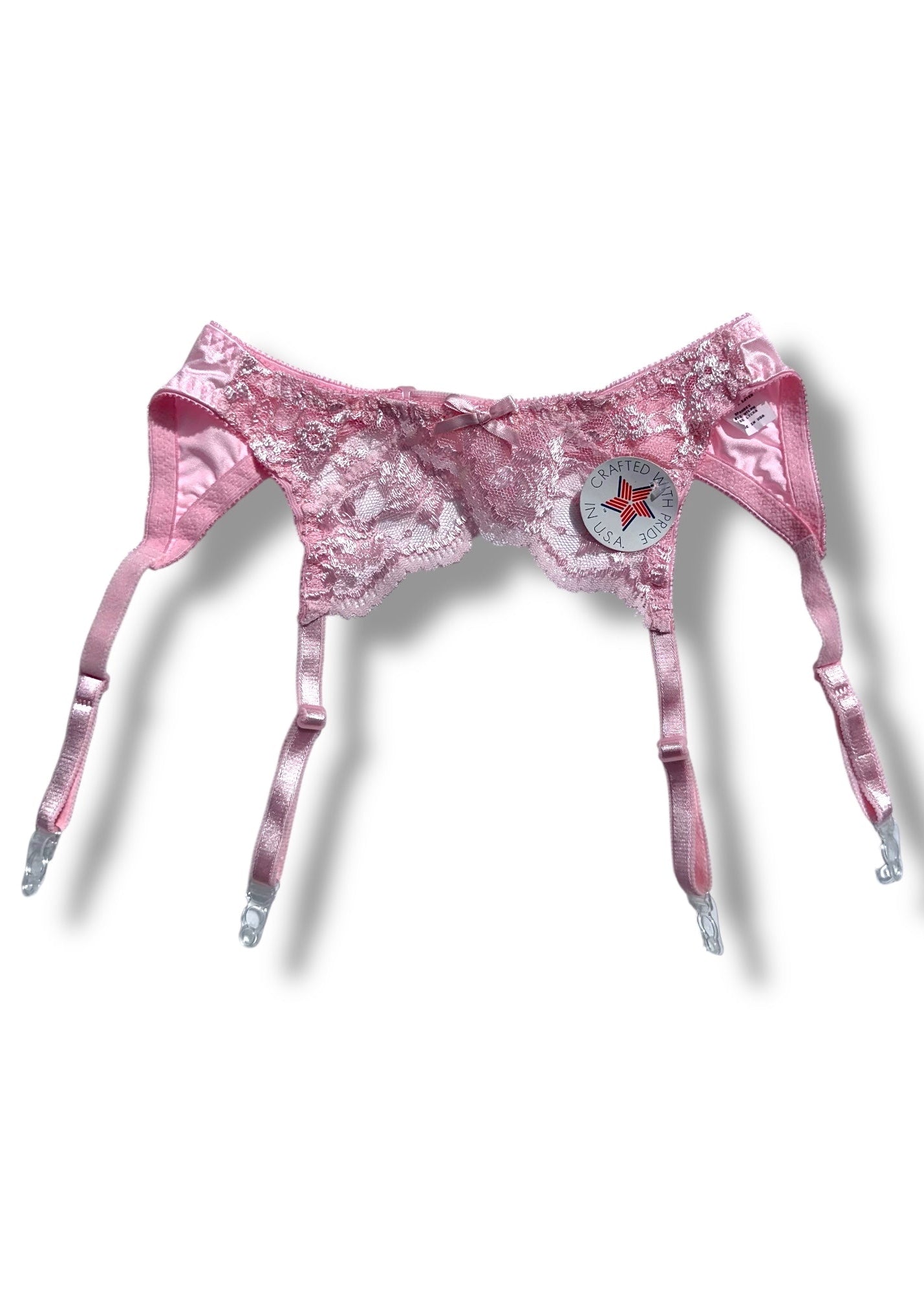 Pink lace lingerie set on a white background