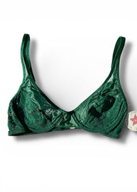 Green bikini top on a white background