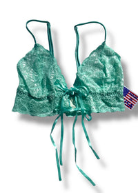 Green lace bikini top with American flag patch on a white background