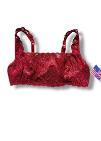 Red lace bralette on a white background with an American flag tag.