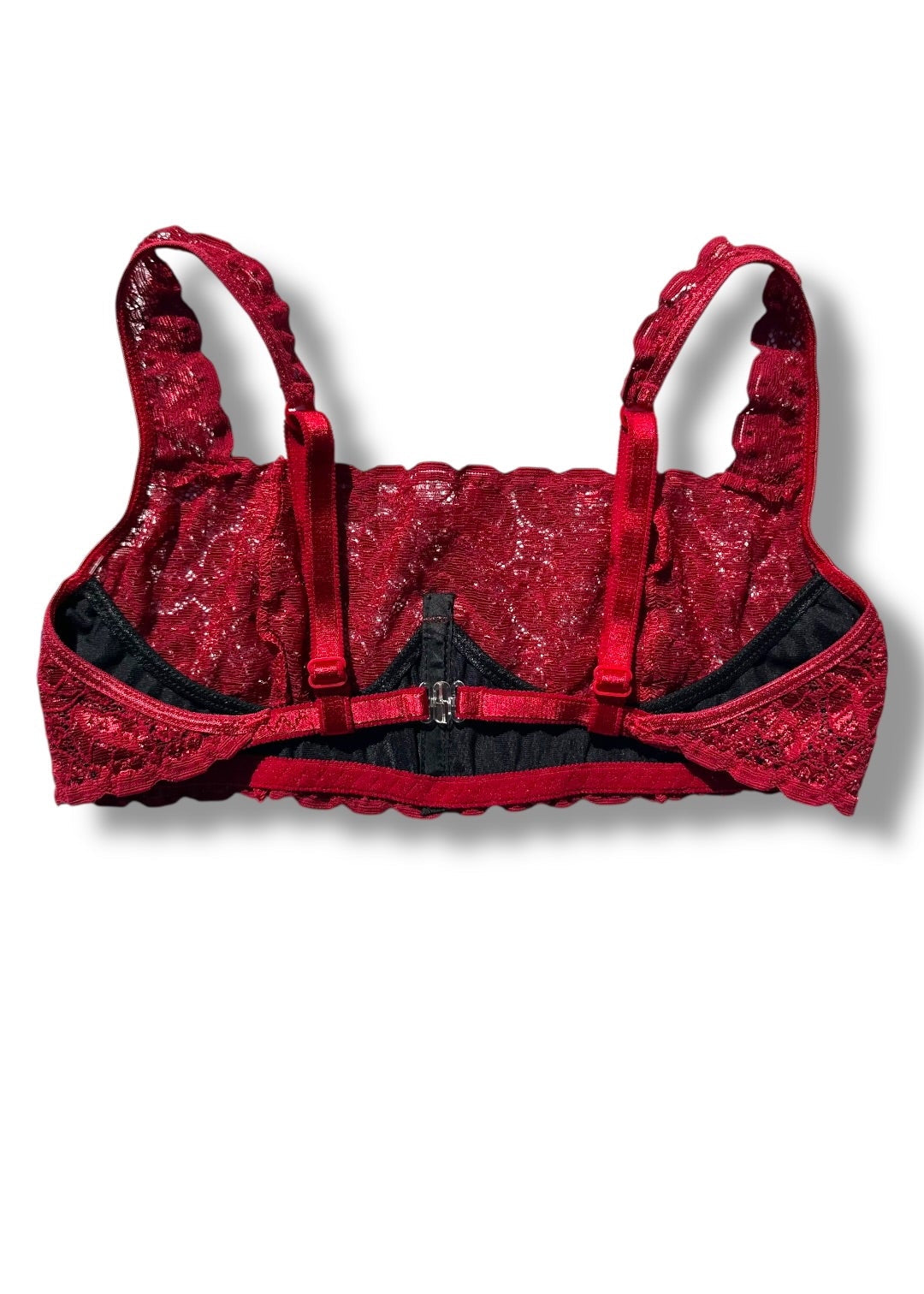 Red lace bra on a white background