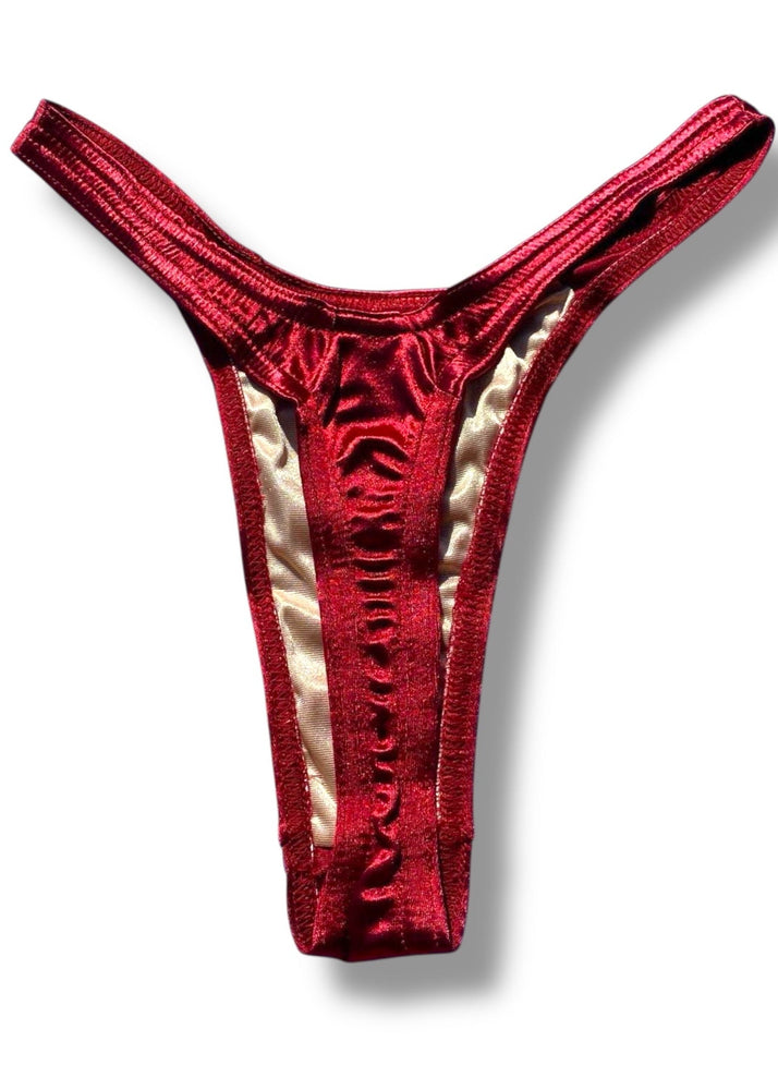 Red thong with gold lining on a white background