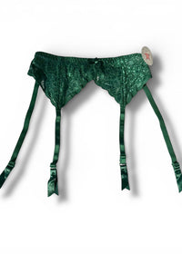 Green lace lingerie set with straps on a white background