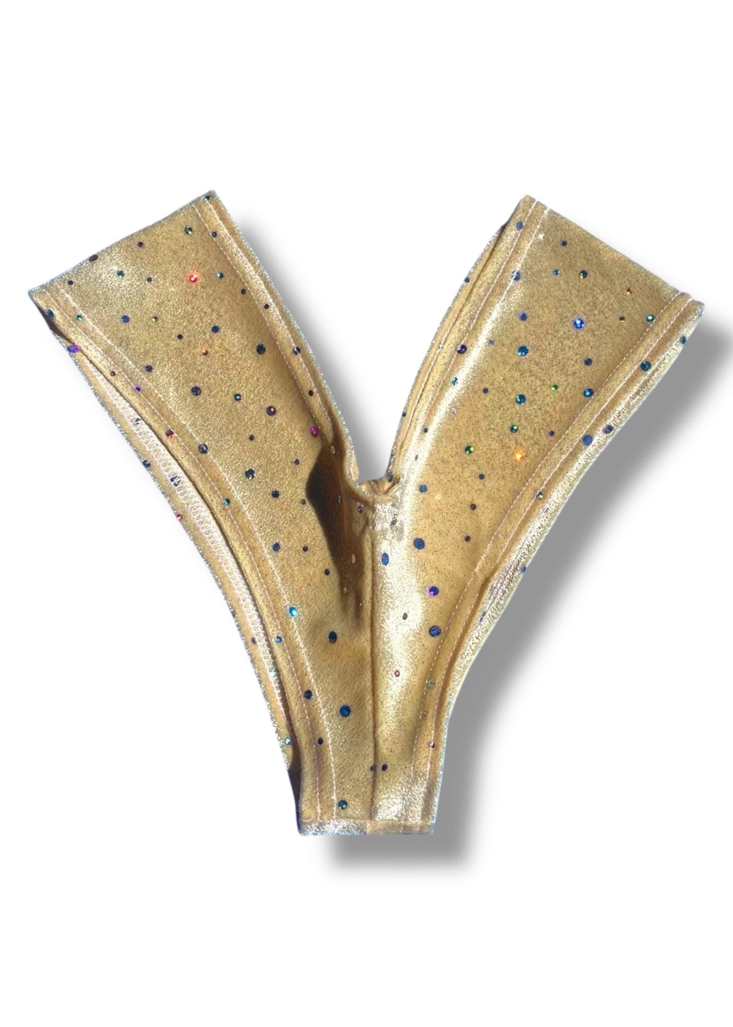 Gold-colored Y-shaped object with speckled pattern on a white background