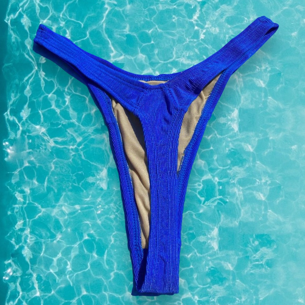 
                      
                        90's Ribbed Retro Shimmer Thong Swimsuit Bottom - Bright Blue
                      
                    