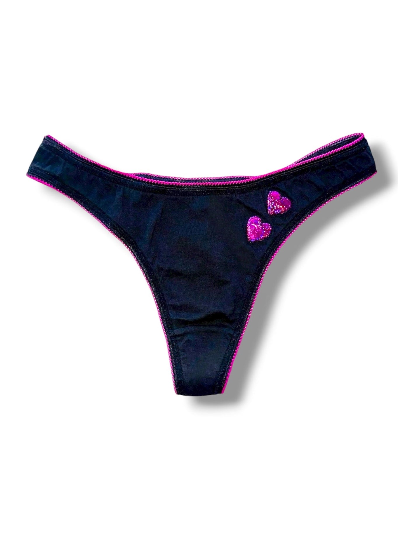 Black thong with pink accents on a white background