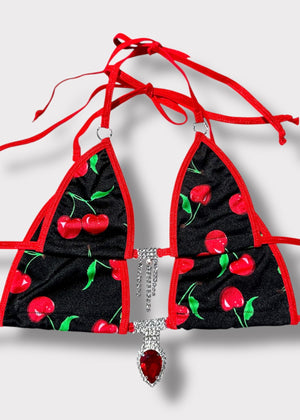 Close-up of black cherry bikini top with silver diamanté embellishments and O-ring detail