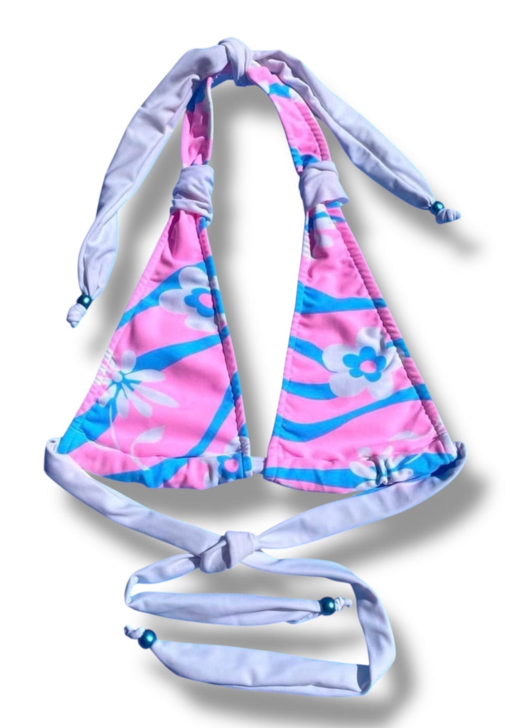 Pink and blue bikini top on a white background