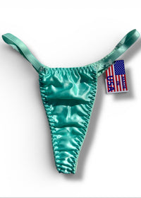 Turquoise bikini bottom with American flag label on a white background