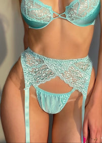 Teal lace lingerie set on a neutral background