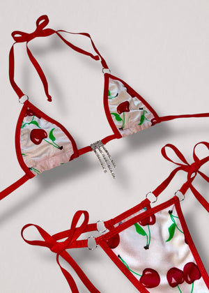 White cherry print bikini with red trim, silver diamanté stones, and silver-tone O-ring connectors – festival swimwear