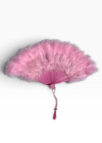 A pink feather fan with a matching pink fabric handle and tassel, displayed against a clean white background.