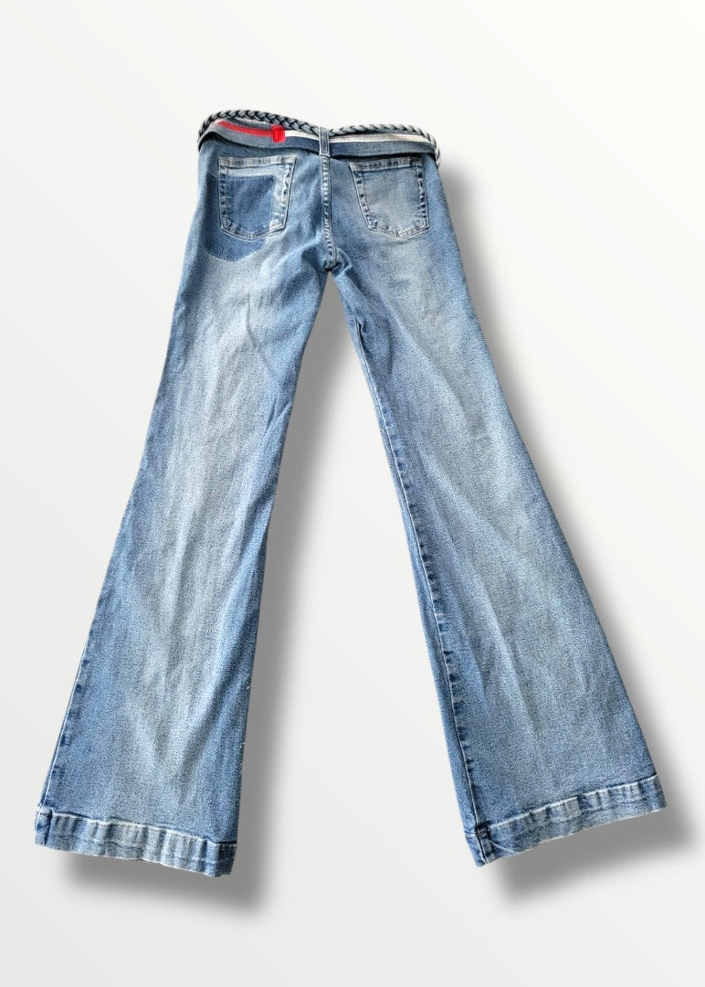 Pair of light blue jeans on a white background