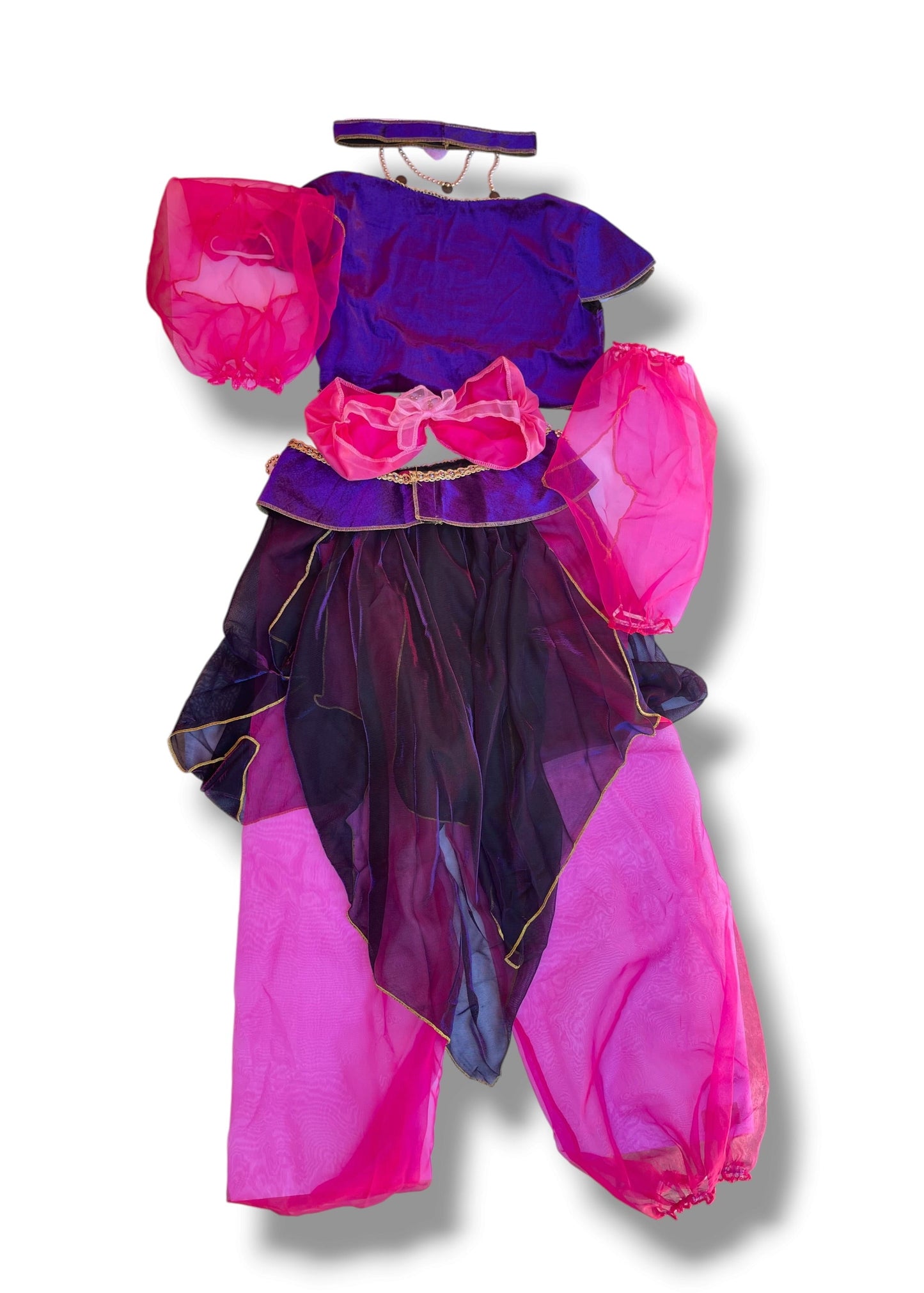 A children's costume set featuring a purple top with bright pink puff sleeves, a matching purple and pink ruffled waist accessory, sheer black tulle skirt panels, and bright pink harem-style pants, displayed on a white background.