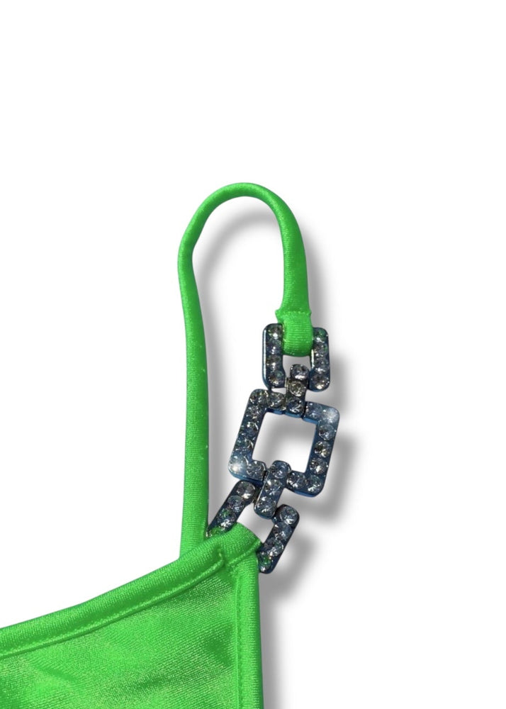 Green bikini top with decorative clasp on a white background