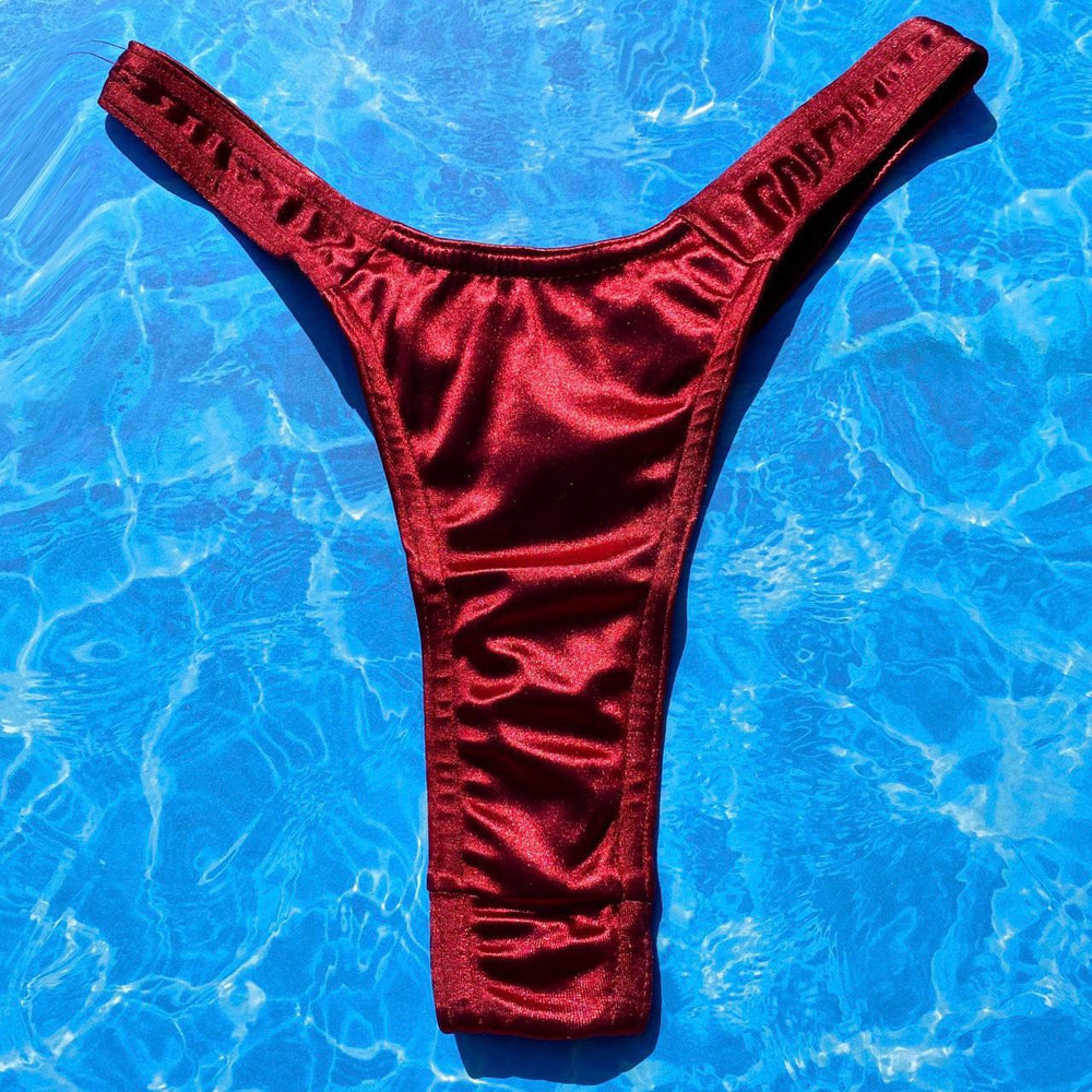 
                      
                        Satin Shimmer Ultra Flattering Thong Bikini Bottom | Cranberry
                      
                    