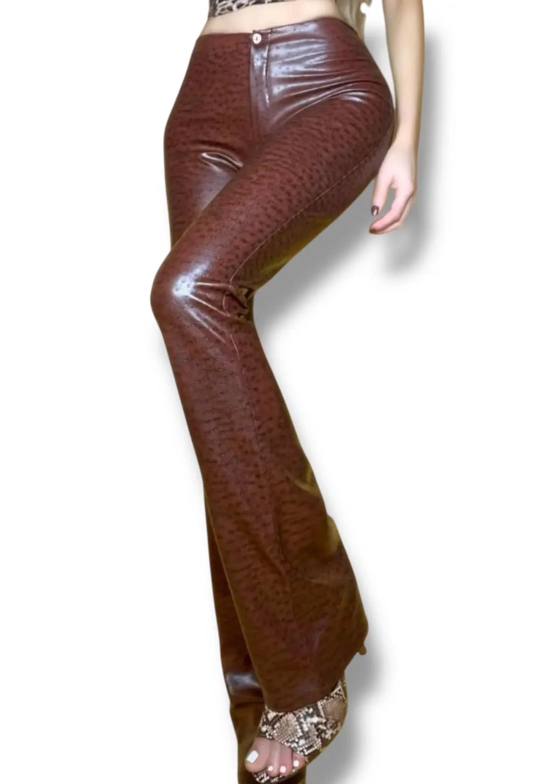 Brown leather pants worn by a person on a white background